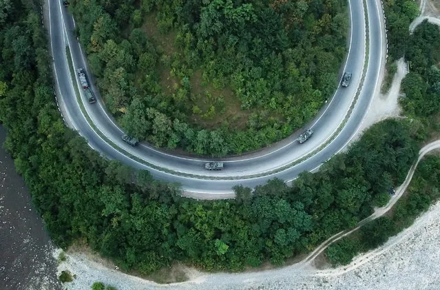 An aerial view shows U.S. military convoy moving along a highway, ahead of the NATO-led military exercises “Noble Partner 2018”, near the town of Zestafoni, Georgia, July 28, 2018. (Photo by Irakli Gedenidze/Reuters)