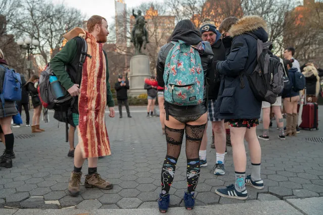 A group mingles at 14th street Union Square meeting point during the 18th annual No Pants Subway Ride on January 13, 2019 in New York City (Photo by David “Dee” Delgado/Getty Images)