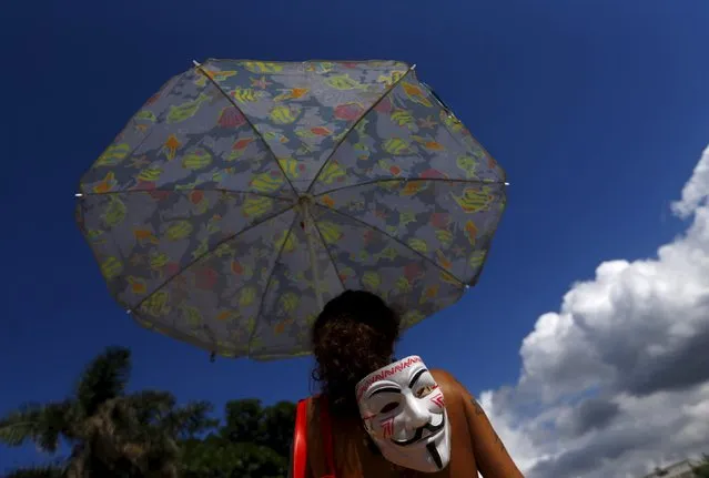 A demonstrator protests against the construction of Rio 2016 Olympic Golf venue in Rio de Janeiro March 25, 2015. (Photo by Ricardo Moraes/Reuters)