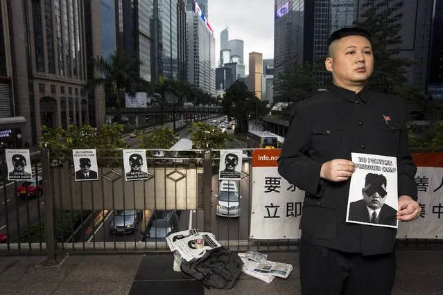 Australian Chinese Howard, 34, a North Korean leader Kim Jong Un lookalike who does not disclose his last name, is paid to participate in a protest urging North Korean Government to improve human rights and abolish political prisoners camp immediately, in Hong Kong December 15, 2013. (Photo by Tyrone Siu/Reuters)