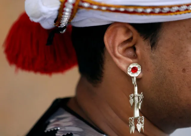 A traditional earring is seen on a school boy who attends Sri Lankan traditional dance training before their graduation ceremony at a Buddhist temple in Colombo, Sri Lanka January 23, 2017. (Photo by Dinuka Liyanawatte/Reuters)