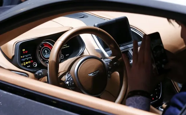The interior of the new Aston Martin DB11 is pictured at the 86th International Motor Show in Geneva, Switzerland, March 1, 2016. (Photo by Denis Balibouse/Reuters)