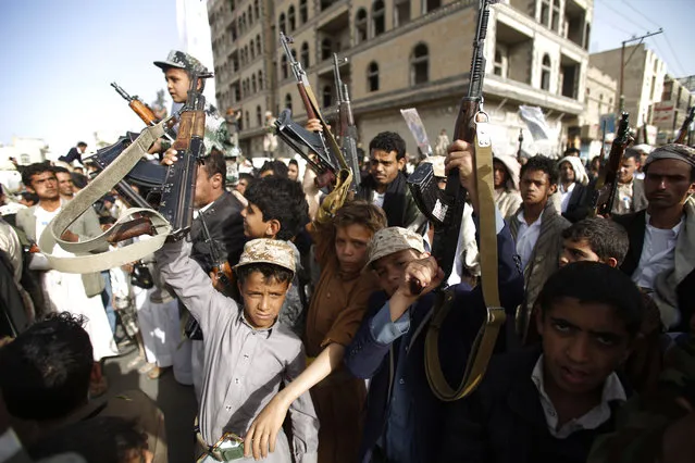 Boys hold up weapons to denounce the Saudi-led airstrikes as they chant slogans during a protest in Sanaa, Yemen, Monday, April 27, 2015. (Photo by Hani Mohammed/AP Photo)