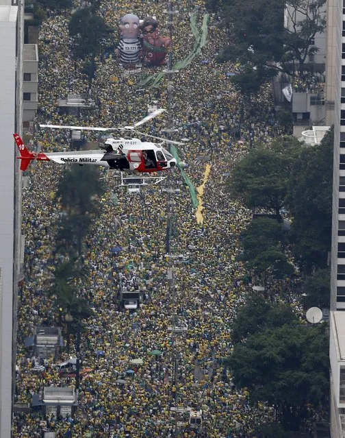 Demonstrators attend a protest against Brazil's President Dilma Rousseff, part of nationwide protests calling for her impeachment, in Sao Paulo, Brazil, March 13, 2016. (Photo by Paulo Whitaker/Reuters)