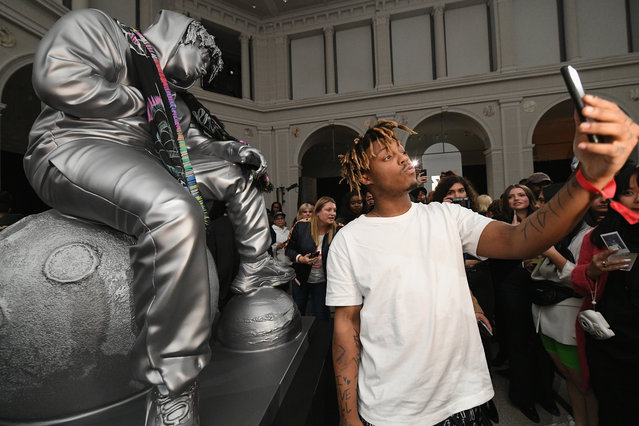 Juice WRLD poses with a sculpture of himself at Spotify's RapCaviar Pantheon at Brooklyn Museum on April 02, 2019 in Brooklyn, New York. (Photo by Dia Dipasupil/Getty Images for Spotify)