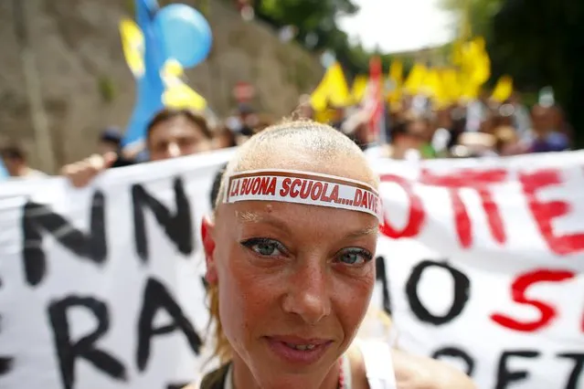 A demonstrator wears a head band that reads “The good school...really” during a protest against  an education reform in Rome, Italy, May 5, 2015. (Photo by Tony Gentile/Reuters)