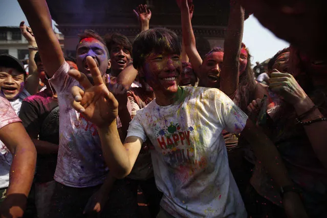 People celebrate Holi, the Festival of Colours, in Kathmandu, Nepal, March 22, 2016. (Photo by Navesh Chitrakar/Reuters)