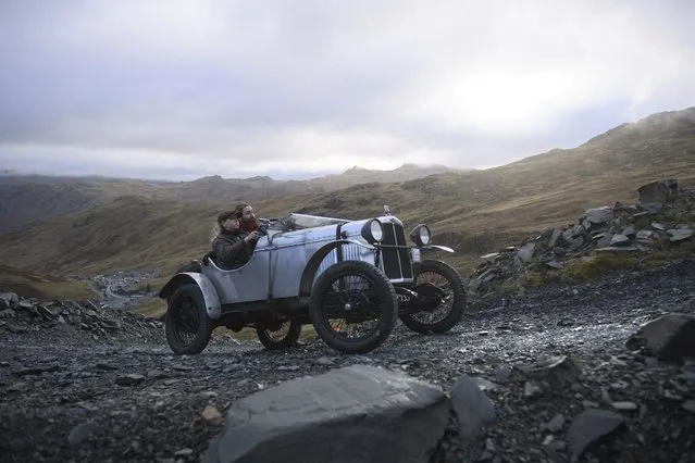 Alexandra Milne-Taylor drives an AJS 2 Seater Sports vintage car dating from 1930 as she takes part in the 52nd annual Lakeland Trial along a quarry road above Honister Slate Mine in Borrowdale,  near Keswick, northern England on November 13, 2021. The event, run by the Vintage Sports-Car Club, is an untimed form of motorsport which takes place over several steep, rough and muddy Lake District hills. (Photo by Oli Scarff/AFP Photo)