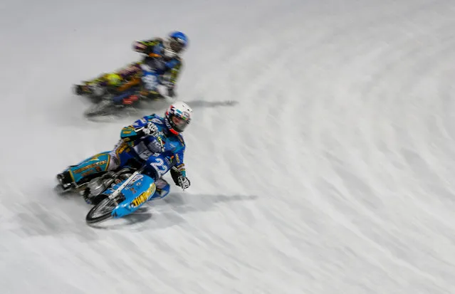 Riders compete during Astana Expo FIM Ice Speedway Gladiators World Championship at the Medeo rink in Almaty, Kazakhstan, February 18, 2017. (Photo by Shamil Zhumatov/Reuters)