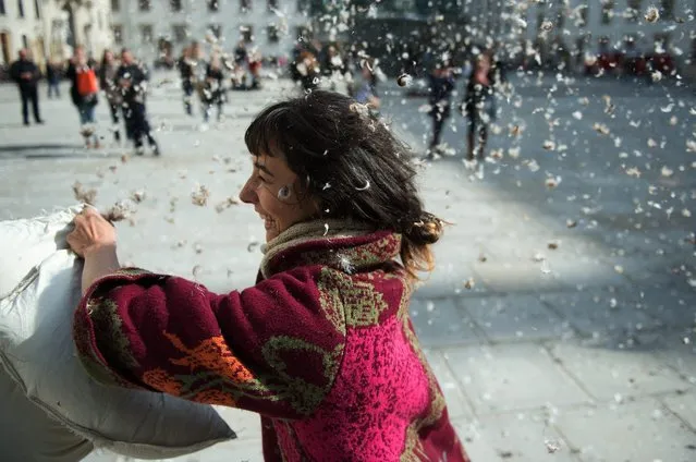 People fight with pillows during the International Pillow Fight Day in Vienna, Austria, 02 April 2016. (Photo by Christian Bruna/EPA)