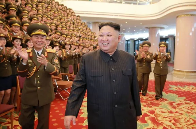 This picture taken on February 22, 2017 and released by North Korea's official Korean Central News Agency (KCNA) on February 23 shows North Korean leader Kim Jong-Un (C) visiting the People's Theatre to mark the 70th anniversary of the founding of the State Merited Chorus in Pyongyang. (Photo by AFP Photo/KCNA)