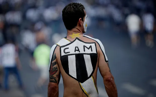 An Atletico Mineiro fan with body paint outside the stadium before the match in Belo Horizonte, Brazil on December 5, 2021. (Photo by Ueslei Marcelino/Reuters)