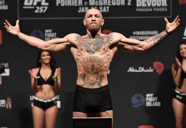 Conor McGregor of Ireland poses on the scale during the UFC 257 weigh-in at Etihad Arena on UFC Fight Island on January 22, 2021 in Abu Dhabi, United Arab Emirates. (Photo by Jeff Bottari/Handout Photo via USA TODAY Sports)