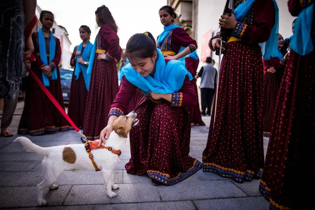 Members of Afghanistan's first all-female orchestra Zohra get ready for their performance in downtown of Bratislava, Slovakia on July 16, 2019. The members of the ensemble are one of the first women in their families and throughout the country to study music in the past 30 years and they often have to deal with various threats. (Photo by Vladimir Simicek/AFP Photo)