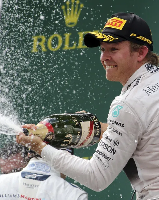 Mercedes driver Nico Rosberg of Germany celebrates his victory following the Austrian Formula One Grand Prix race in Spielberg, southern Austria, Sunday, June 21, 2015. (AP Photo/Ronald Zak)