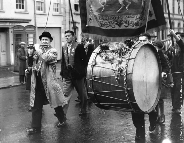 1951: A flautist and lambeg drummer marching with their Orange Lodge in Belfast, Northern Ireland, to celebrate the victory of William III over James II in 1690 and  to re-affirm their loyalty to the king and empire