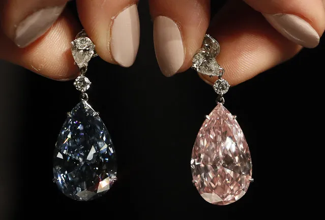 The Apollo blue diamond and the Artemis pink diamond earrings are displayed at Sotheby's auction rooms in London, Monday, April 10, 2017. The earrings, the most valuable ever to appear at auction, are estimated at 62- 87 million UK pounds (50-70 million US dollars) and will be auctioned on May 16 in Geneva. (Photo by Kirsty Wigglesworth/AP Photo)