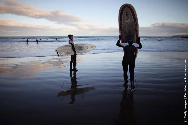 Surfers Brave The Cold To Enjoy Year Round Surfing