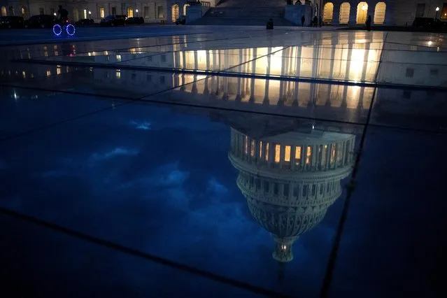 A bicyclist rides along the East Front Plaza at the U.S. Capitol in Washington, U.S., November 18, 2021. (Photo by Tom Brenner/Reuters)