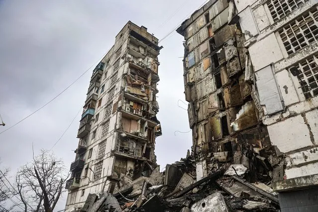 A building damaged during fighting is seen in Mariupol, on the territory which is now under the Government of the Donetsk People's Republic control, eastern in Mariupol, Ukraine, Wednesday, April 13, 2022. (Photo by Alexei Alexandrov/AP Photo)