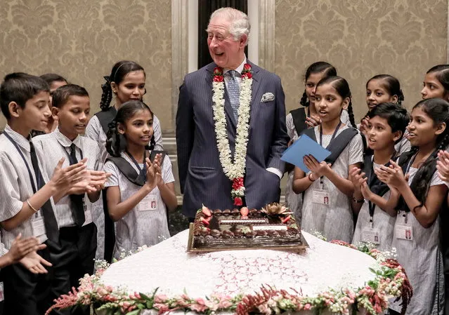 Britain's Charles, Prince of Wales celebrates his birthday with school children from the Kaivalya Education Foundation, which is supported by the British Asian Trust, during his visit in Mumbai, India, 14 November 2019. Prince Charles, who on his 10th royal visit to India, celebrated his 71st birthday on 14 November 2019. (Photo by Divyakant Solanki/EPA/EFE)