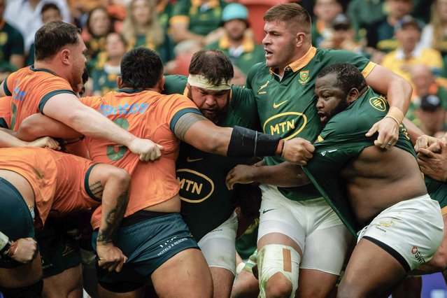 South Africa's Frans Malherbe (C), South Africa's Malcolm Marx (2nd R), and South Africa's Ox Nche (R) fight for the ball with Australia's players during the Rugby Championship match between Australia and South Africa at Suncorp Stadium in Brisbane on August 10, 2024. (Photo by Patrick Hamilton/AFP Photo)