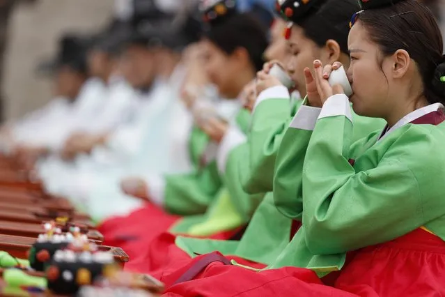 Twenty-year-old South Koreans wearing traditional costumes participate in the 45th Coming of Age Day ceremony at Namsangol Hanok Village in Seoul, South Korea, 15 May 2017. (Photo by Jeon Heon-Kyun/EPA)