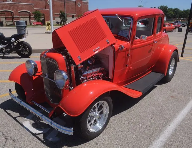 This 1932 Ford 5 window coupe was one of over 150 cars at the eighth annual historic U.S Route 40 Mini-Nationals car show held on Sunday at Tecumseh high school. (Photo by Marshall Gorby/AP Photo)