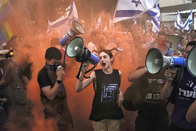 Demonstrators shout slogans during a protest against plans by Prime Minister Benjamin Netanyahu's government to overhaul the judicial system, in Tel Aviv, Israel, Thursday, July 20, 2023. (Photo by Ariel Schalit/AP Photo)