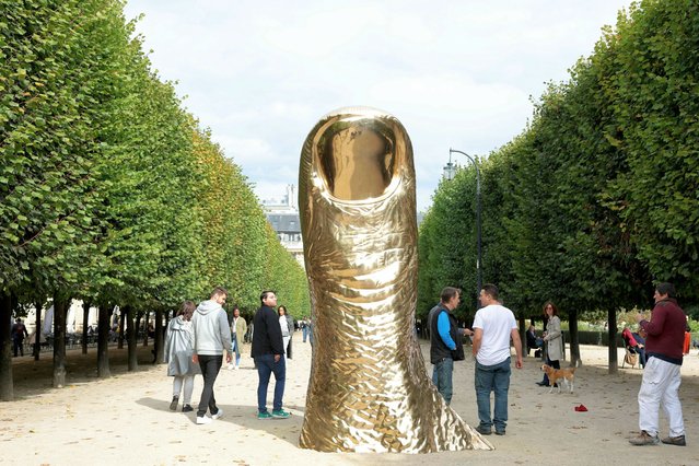 This photograph shows the installation of French artist Cesar Baldaccini, titled “Cesar's Pouce”, at Palais-Royal Garden public park, in Paris, on October 15, 2024, as part of the Art Basel Paris 2024’s Public Program. (Photo by Thomas Samson/AFP Photo)