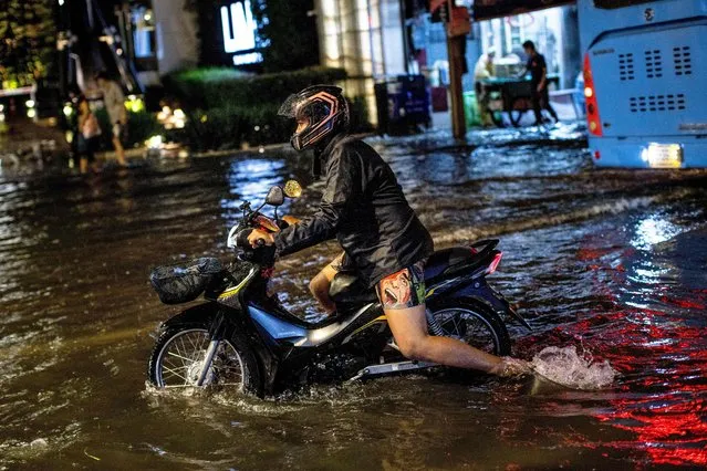 Street after heavy rain in Bangkok on May 18, 2022. (Photo by Jack Taylor/AFP Photo)