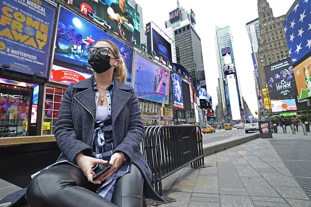 New Yorker Alexandra Besze, 25, a photo editor currenty out of work due to the corona virus decides to come experience an empty Times Square on March 19, 2020. (Photo by Matthew McDermott/The New York Post)