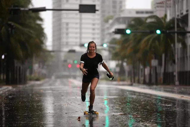 A local resident rides a skateboard before the arrival of Hurricane Irma to south Florida, in Miami Beach, Florida September 9, 2017. (Photo by Carlos Barria/Reuters)