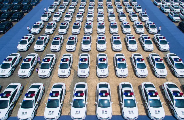New police cars assigned for the upcoming G20 Hangzhou summit are lined up at a delivery ceremony in Hangzhou, China on July 20, 2016. (Photo by Imaginechina/Rex Features/Shutterstock)