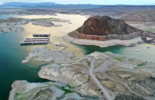 An aerial view of a “bathtub ring” of mineral deposits left by higher water levels at the drought-stricken Elephant Butte Reservoir on August 15, 2022 near Truth or Consequences, New Mexico. New Mexico's largest reservoir is currently at 3.8 percent of its total capacity in spite of recent monsoon rains in the state. According to officials, water levels at Elephant Butte have been below average since around 2019 and the lake has not been able to meet full levels of irrigation demand for several years. Experts say that in spite of the monsoon rains bringing temporary relief to parts of the Southwest, the climate change-fueled megadrought remains entrenched in the West. (Photo by Mario Tama/Getty Images)