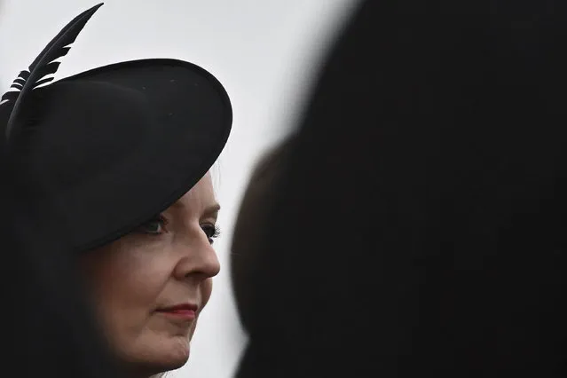 Britain's Prime Minister Liz Truss waits for the arrival of the coffin of Queen Elizabeth II, at the Royal Air Force Northolt, London, Tuesday, September 13, 2022. (Photo by Ben Stansall, Pool Photo via AP Photo)