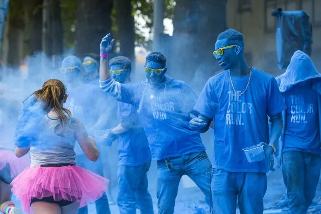 People take part in The Color Run in Brussels, Belgium September 6, 2015. (Photo by Yves Herman/Reuters)