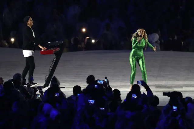 Electronic music artist Kygo and singer-songwriter Julia Michaels perform the song "Carry Me" during the Closing Ceremony on Day 16 of the Rio 2016 Olympic Games at Maracana Stadium on August 21, 2016 in Rio de Janeiro, Brazil. (Photo by Alexander Hassenstein/Getty Images)