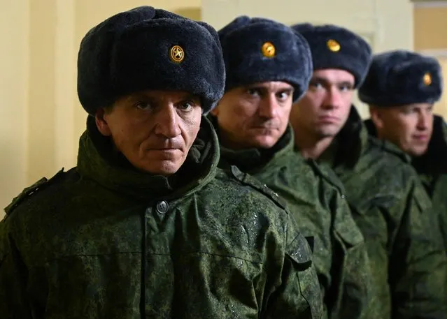 Russian reservists recruited during the partial mobilisation of troops line up as they receive gear before departing to the zone of Russia-Ukraine conflict, in the Rostov region, Russia on October 31, 2022. (Photo by Sergey Pivovarov/Reuters)