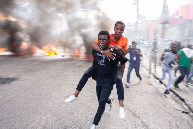 People protest to demand the departure of the Transitional Presidential Council due to insecurity and gang violence in Port-au-Prince, Haiti on March 26, 2025. While authorities, including the National Palace and several ministries have all left downtown to escape the armed gang attacks in Port-au-Prince. Meanwhile, the people continue to fall victim to gang bullets. (Photo by Guerinault Louis/Anadolu via Getty Images)