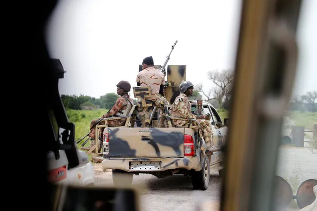 A Nigerian army convoy vehicle drives ahead with an anti-aircraft gun, on its way to Bama, Borno State, Nigeria August 31, 2016. (Photo by Afolabi Sotunde/Reuters)