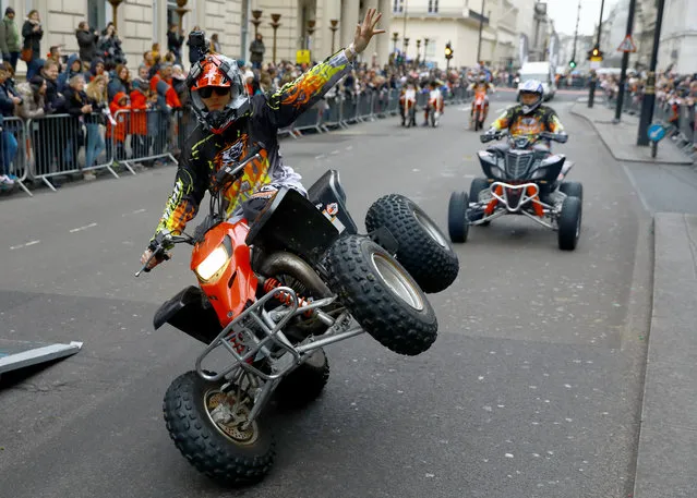 A motorcycle stunt rider takes part in the annual New Years Day Parade in London, Britain, 01 January 2018. Reports state that 8,000 performers representing the London boroughs and countries from across the globe are parading along the streets of London's West End on New Year’s Day. (Photo by Neil Hall/EPA/EFE)