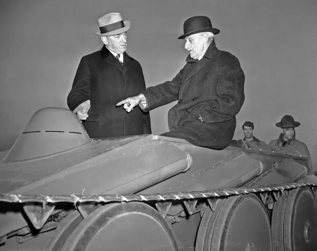 J. Walter Christie, right, 70-year-old inventor, shows tank to Governor James M. Curley on December 14, 1937. (Photo by AP Photo)