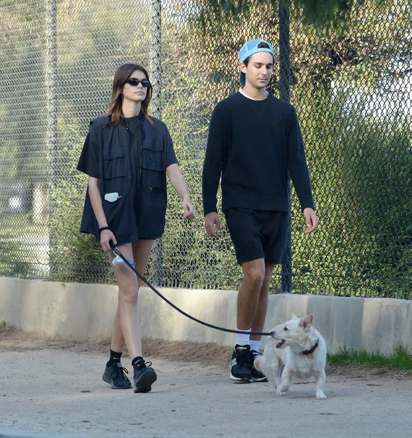 Kaia Gerber spotted out for a stroll with her dog and a friend at SilverLake in Los Angeles on December 5, 2022. The American supermodel wore a cargo vest, bicycle shorts, and black trainers. (Photo by The Image Direct)