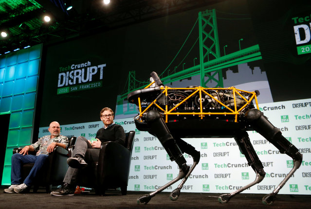Boston Dynamics' Spot robot walks on stage while Marc Raibert of Boston Dynamics speaks with Brian Heater of TechCrunch during 2016 TechCrunch Disrupt in San Francisco, California, U.S. September 14, 2016. (Photo by Beck Diefenbach/Reuters)
