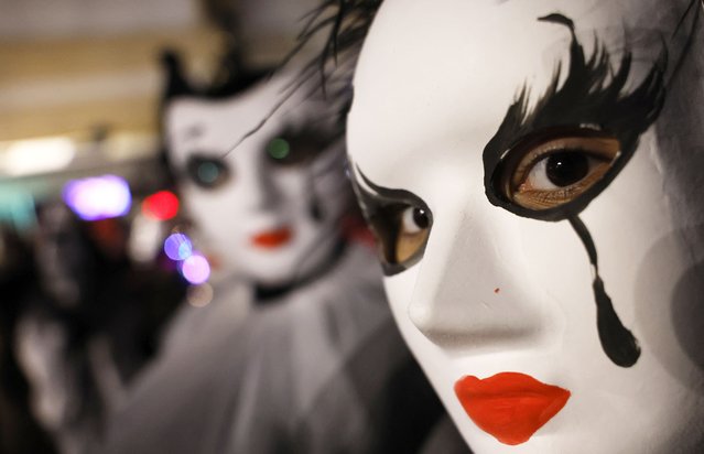 A carnival member performs during a carnival procession of the closing carnival night in the town of Strumica, southeastern North Macedonia, 16 March 2024. North Macedonians are marking Trimery, an Orthodox Christian holiday, when evil spirits are chased away with dance rituals. The holiday marks the beginning of the fasting period ahead of Easter. (Photo by Georgi Licovski/EPA/EFE)
