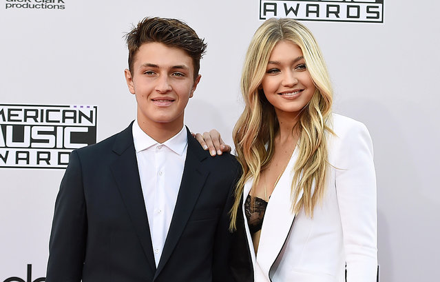 Anwar Hadid, left, and  Gigi Hadid arrive at the 42nd annual American Music Awards at Nokia Theatre L.A. Live on Sunday, November 23, 2014, in Los Angeles. (Photo by John Shearer/Invision/AP Photo)