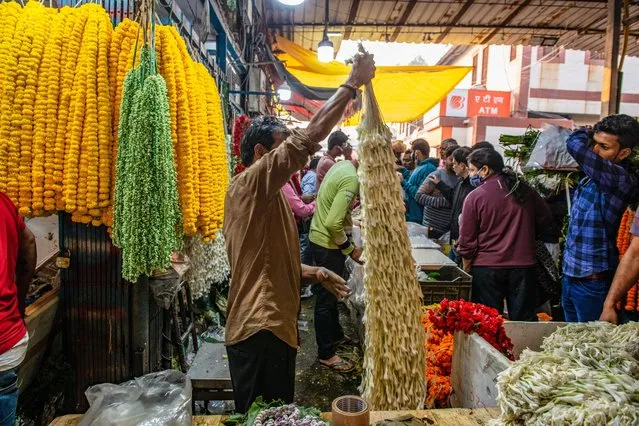 A man selling garland of Rajnigandha (Agave Amica) flower on the day of Diwali festival at the Ghazipur Wholesale Flower Market on October 24, 2022. People buy flowers for Diwali decoration, flowers are also commonly used as offerings to the gods Lakshmi and Ganesh. (Photo by Pradeep Gaur/SOPA Images/Rex Features/Shutterstock)