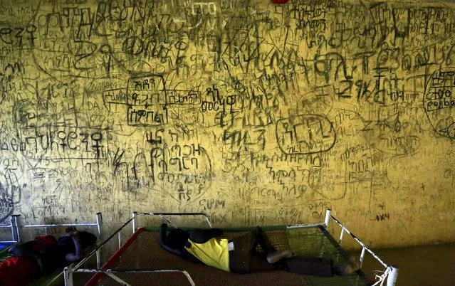 Eritrean asylum seekers rest inside a new arrivals center in Wad Sharifey refugee camp during a visit by European Union Ambassadors to the camp at Kassala State in East Sudan October 22, 2015. (Photo by Mohamed Nureldin Abdallah/Reuters)