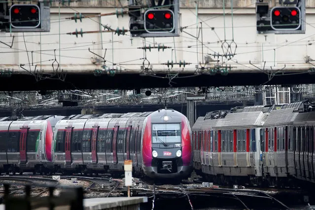 A train arrives at the Gare Saint-Lazare railway station during a nationwide strike by French SNCF railway workers, in Paris, France, March 22, 2018. (Photo by Stephane Mahe/Reuters)